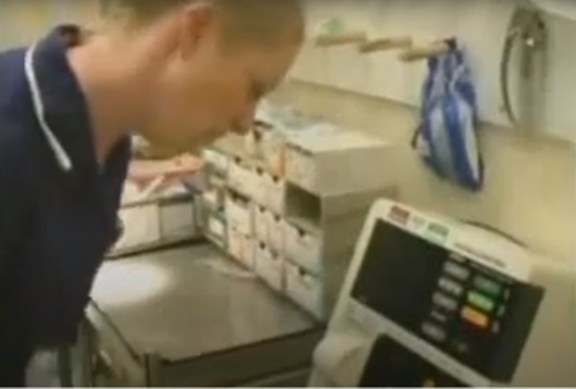 Nurse checking monitor