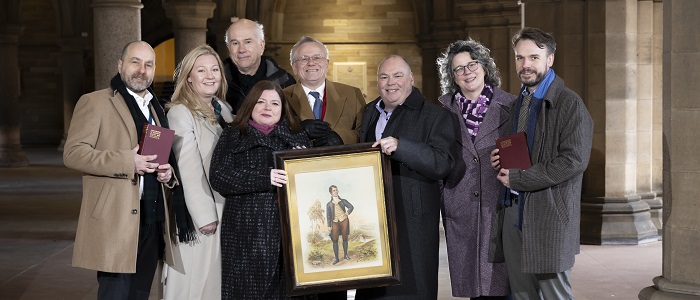 An image of the full team of the Centre for Robert Burns Studies in the Cloisters. Credit Martin Shields