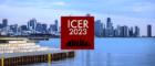 ICER 2023 logo over a Chicago city skyline background