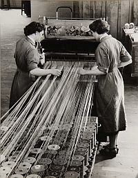 Chrissie Martin and Jessie Bell weaving a carpet in May 1955.