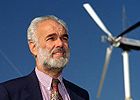 Robert Thresher beside wind turbine