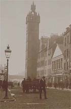 Photograph showing south end of High Steet, Glasgow, looking towards the Tolbooth, 1890s. Shows buildings, people and rear view of horse-drawn cart. (Photo B12, No 27) Links to more information about this item.