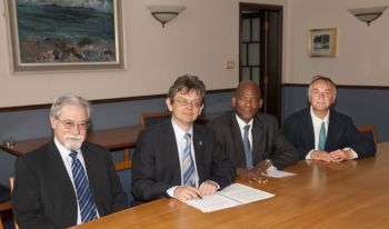 Principal Professor Anton Muscatelli is joined by the High Commissioner of South Africa and other in signing an historic MOU with the University of South Africa