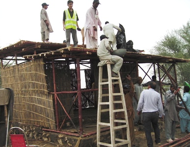 Construction underway of an Green KaravanGhar, temporary housing for flood-hit Swat Valley in Pakistan. The Project was funded by Scottish Government and led by Glasgow University.
