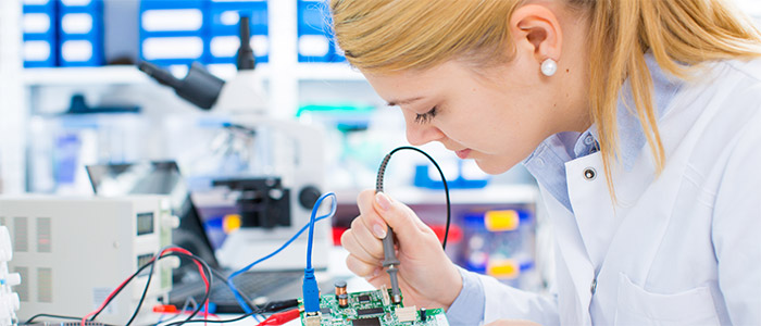 Female laboratory assistant Repairs PCB module 