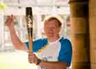 Dr Des Gilmore with the Queen's Baton July 2014  140 section image