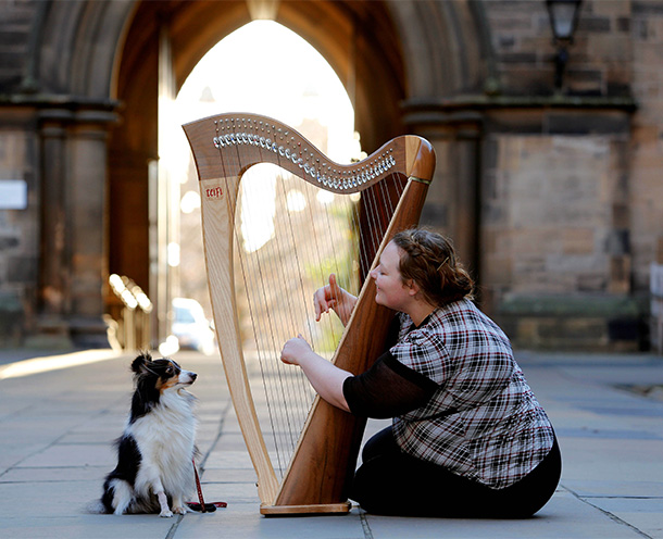Harp player with dog
