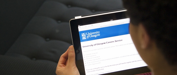 a student viewing Careers Service info on a tablet device