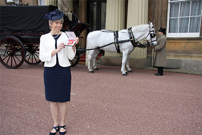 Prof. Sarah Cleaveland is awarded an OBE at Buckingham Palace, February 2015
