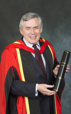 Image of Gordon Brown holding his honorary degree, awarded in April 2015