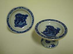 Pair of Blue and White ceramic salt stands from Whistler's ceramics collection. GLAHA 54422 and 54577. Decorated with Chinese imagery, mythological creature 