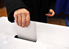 Close up image of a person voting 