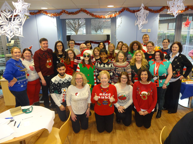 Image of the fund-raising WTCMP staff in their Christmas jumpers