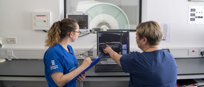 Researchers look at a screen in the SAH