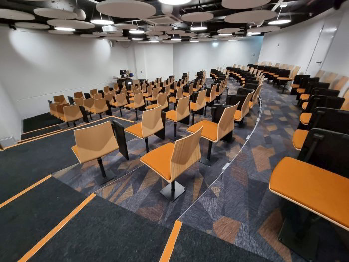 Raked lecture theatre with fixed tablet chairs