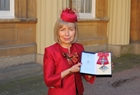 Professor Dame Anna Dominiczak at Buckingham Palace with her damehood