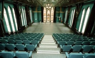 modern theatre seating inside an old church