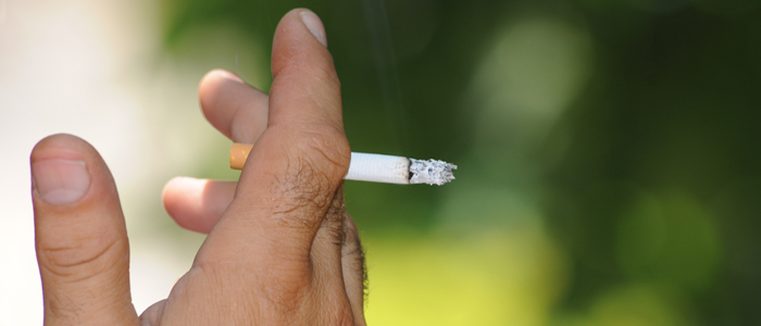 Close up of hand and cigarette
