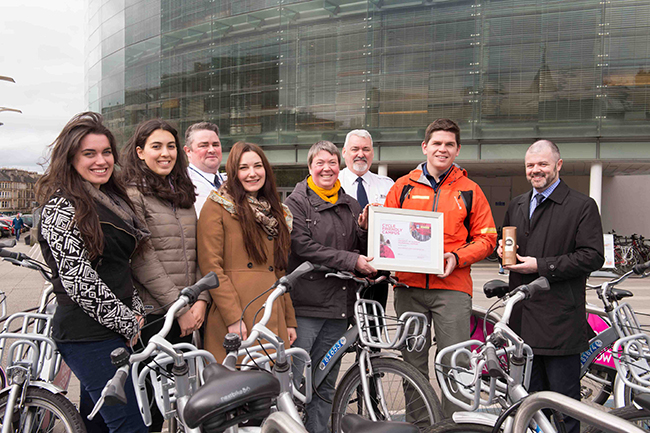 Image of the University cycling and active travel team being presented with the Cycle Friendly Campus award. 