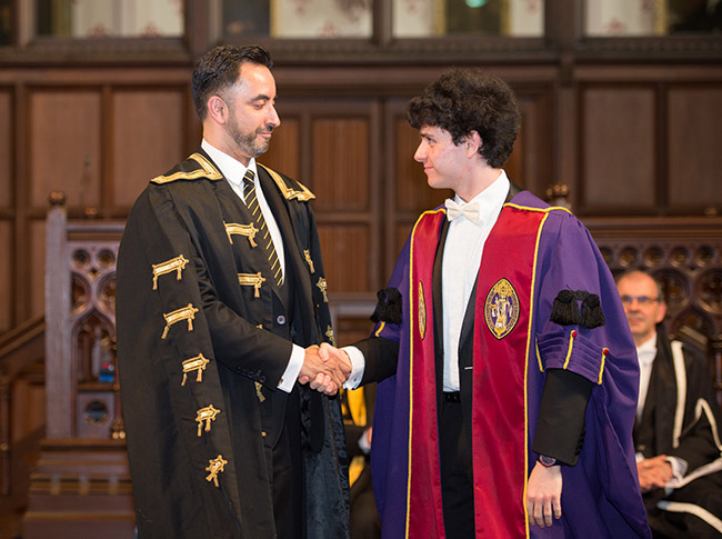 Image of Aamer Anwar, newly installed Rector, shaking hands with SRC President Ameer Ibrahim