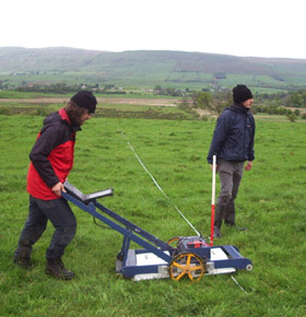 John Malcolm and Olly O’Grady with the Utsi Groundview ground penetrating radar, at Auchendavy on the Antonine Wall, summer 2007

