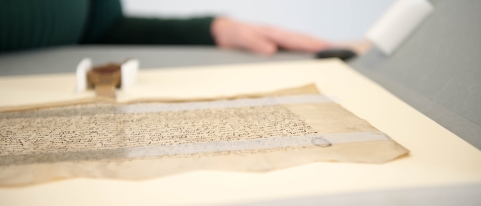 An ancient manuscript on a desk in the Hunterian