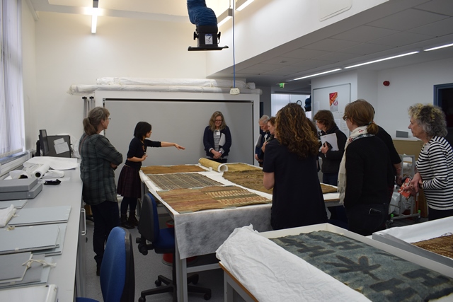 A group of University of Glasgow staff, students and conservators at a barkcloth workshop with expert American Samoans