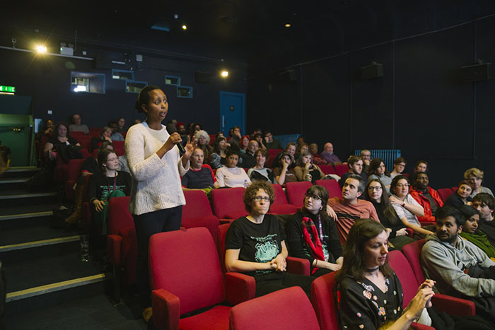 An audience member asks a question at an Africa in Motion screening