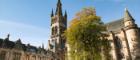 Photo of University of Glasgow main building against blue sky