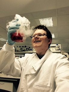 PhD Student Testimonials - photo of student in lab