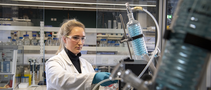 a female technician working with lab equipment