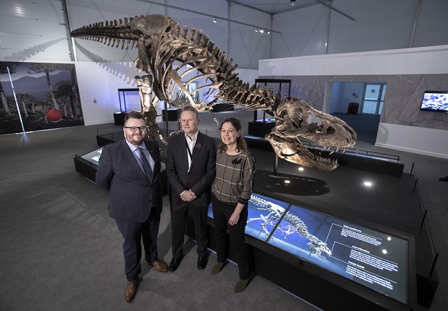 Left to Right Cllr David McDonald; Steph Scholten, and Caroline Bruenese with Trix the T.rex at the official opening for the T.rex in Town exhibition at Kelvin Hall Photo Credit Martin Shields