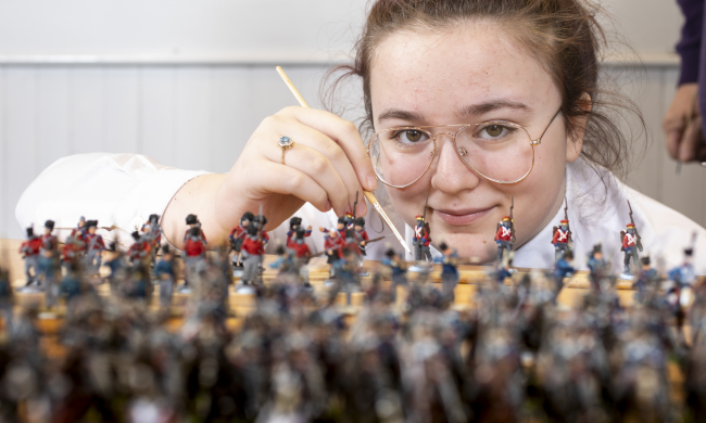Lucy Wallace, S3 Pupil, Clydebank High School, helping to paint some of the 22,000 28mm figures to be used in The Great Game: Waterloo Replayed which will be  the biggest ever historical table top war game. Photo Credit Martin Shields