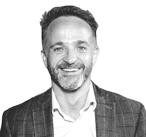 Black and white profile photo of Dr Nick Quinn, Senior Lecturer in Entrepreneurship, and Director of the MBA and Executive Education