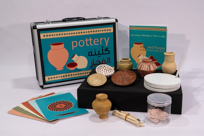 A photo of a pottery school box resource for children in Iraq created to help them understand their history with support from University of Glasgow archaeologists