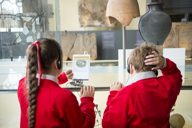 Children using ipads in a museum as part of the EMOTIVE project which allows users to imagine what life might have been like hundreds of years ago through the power of Virtual Reality/Augmented Reality technology and digital storytelling