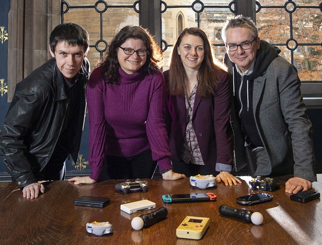 Photo caption left to right: Dr Timothy Peacock , Lecturer in History; Dr Dimitra Fimi, Lecturer in Fantasy and Children's Literature ; Dr Jane Draycott , Lecturer in Classics , and Dr Matthew Barr, Lecturer in Computing Science who are co - directors and co - founders of the University of Glasgow’s Games and Gaming La