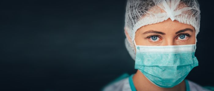 An image of a female doctor wearing face mask