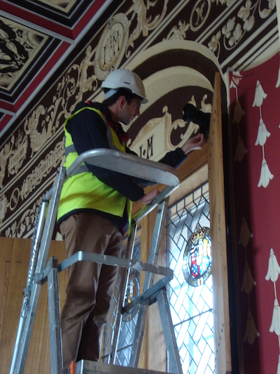 Installing a camera to take images of the tapestry. © University of Glasgow, courtesy of Historic Environment Scotland
