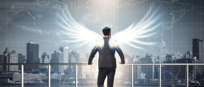 Image of a businessman with angel wings