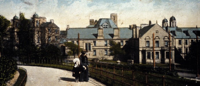 postcard of Victoria Infirmary with woman and child in foreground1911