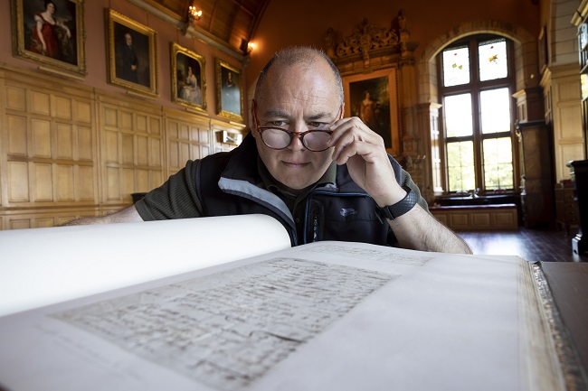 Professor Gerard Carruthers of the University of Glasgow, a world leading expert on Scotland’s national bard, looking through Burnsiana. Photo Credit Martin Shields 