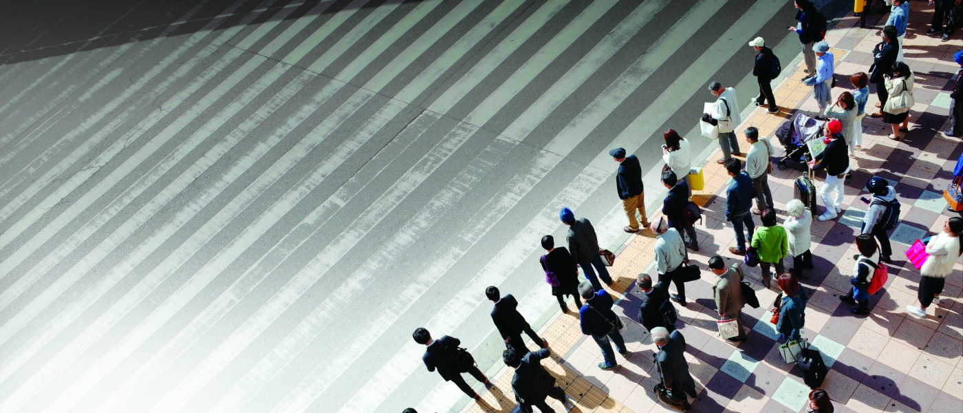 Image of people at a pedestrian crossing