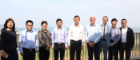 Deans David Young and Robert Partridge stand with group of senior colleagues at Hainan Campus