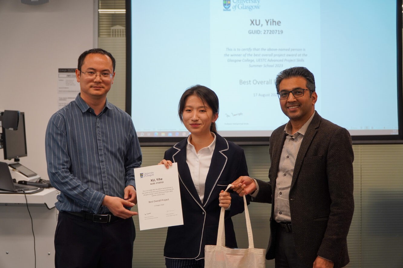 Student prize-winner with 2 academic staff members