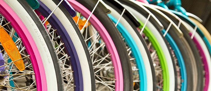 Close up of bike wheels in bright colours