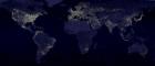 A image of the world dotted with clusters of lights on parts of the continents