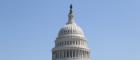 The dome of the US Capitol against a blue sky