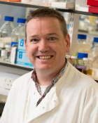 A head and shoulders shot of Dr Donal Wall in the lab