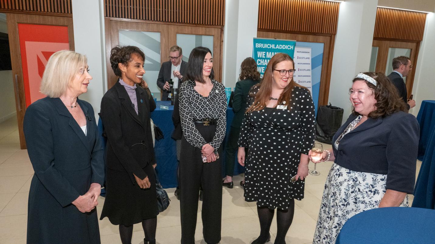 A group standing together talking featuring Sara Carter, Cecilia Rouse and Amy Laux Source: Charlotte Morris